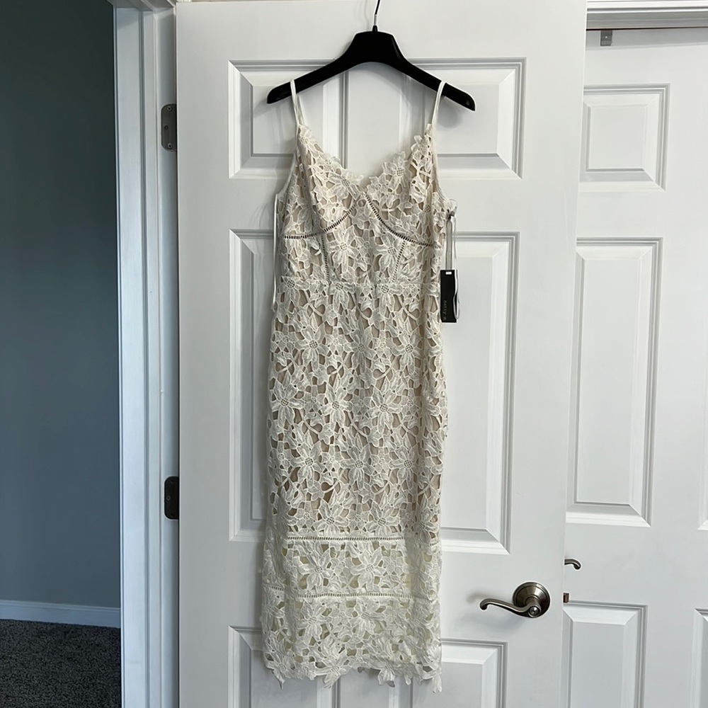 NWT off white dress. Bought for rehearsal dinner but never wore.